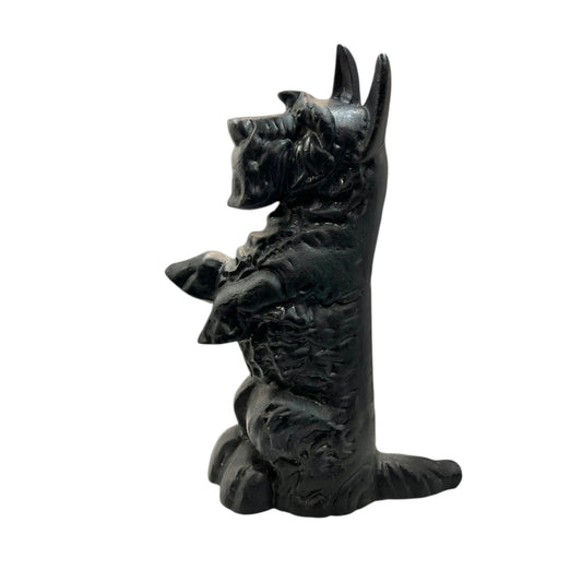 Black Scottish terrier cast iron doorstop on a white background 