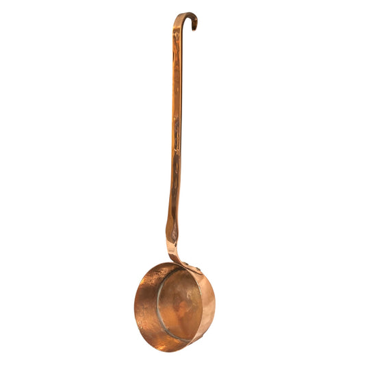 French vintage copper ladle on a white background 