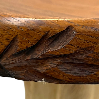 close up of taxidermy plant stand carving