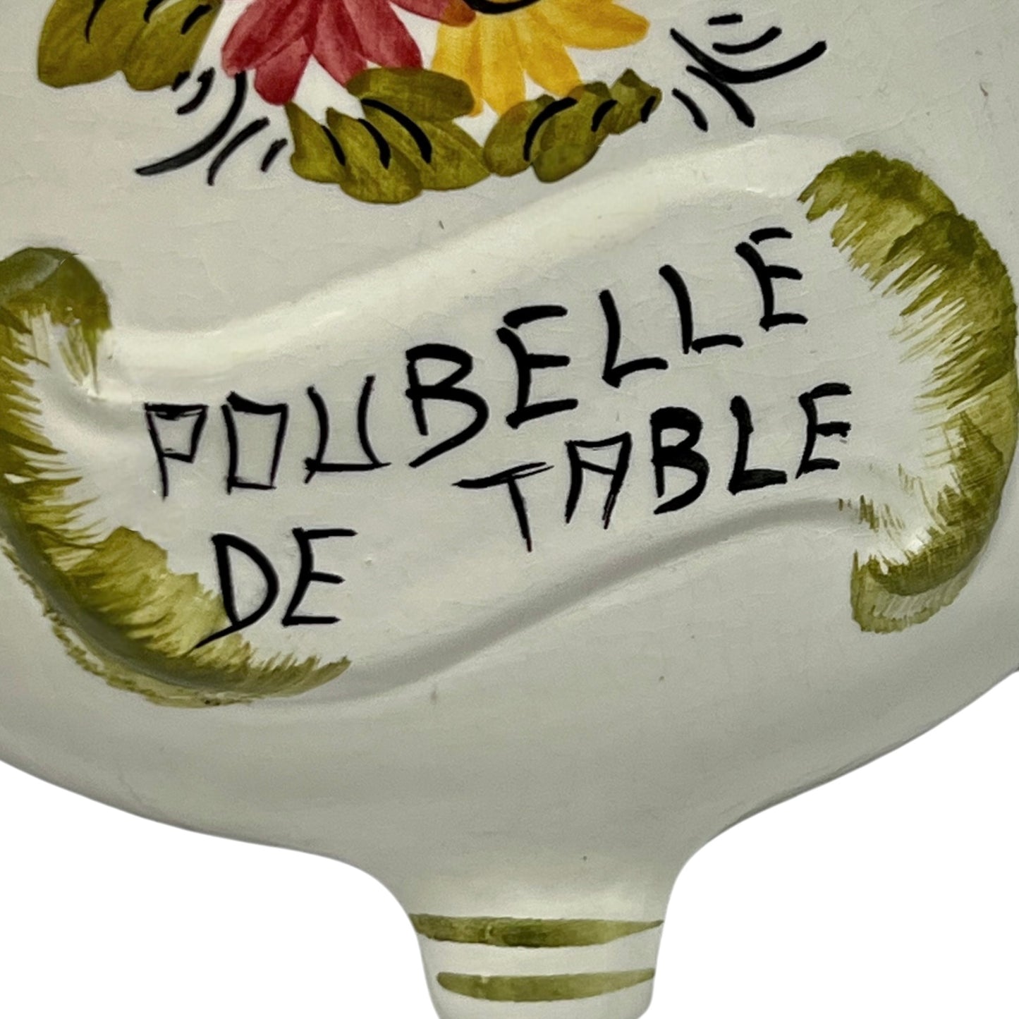 Decorative ceramic item with floral design and text 'POUBELLE DE TABLE' on a white background