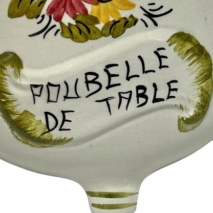 Decorative ceramic item with floral design and text 'POUBELLE DE TABLE' on a white background