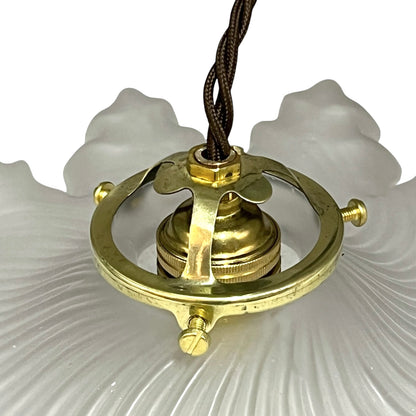 A French vintage Art Deco-style lampshade made of clear frosted glass with a frilled edge, with twisted-style wiring and brass fittings, perfect for adding charm to a period room or retro home, displayed against a white background.