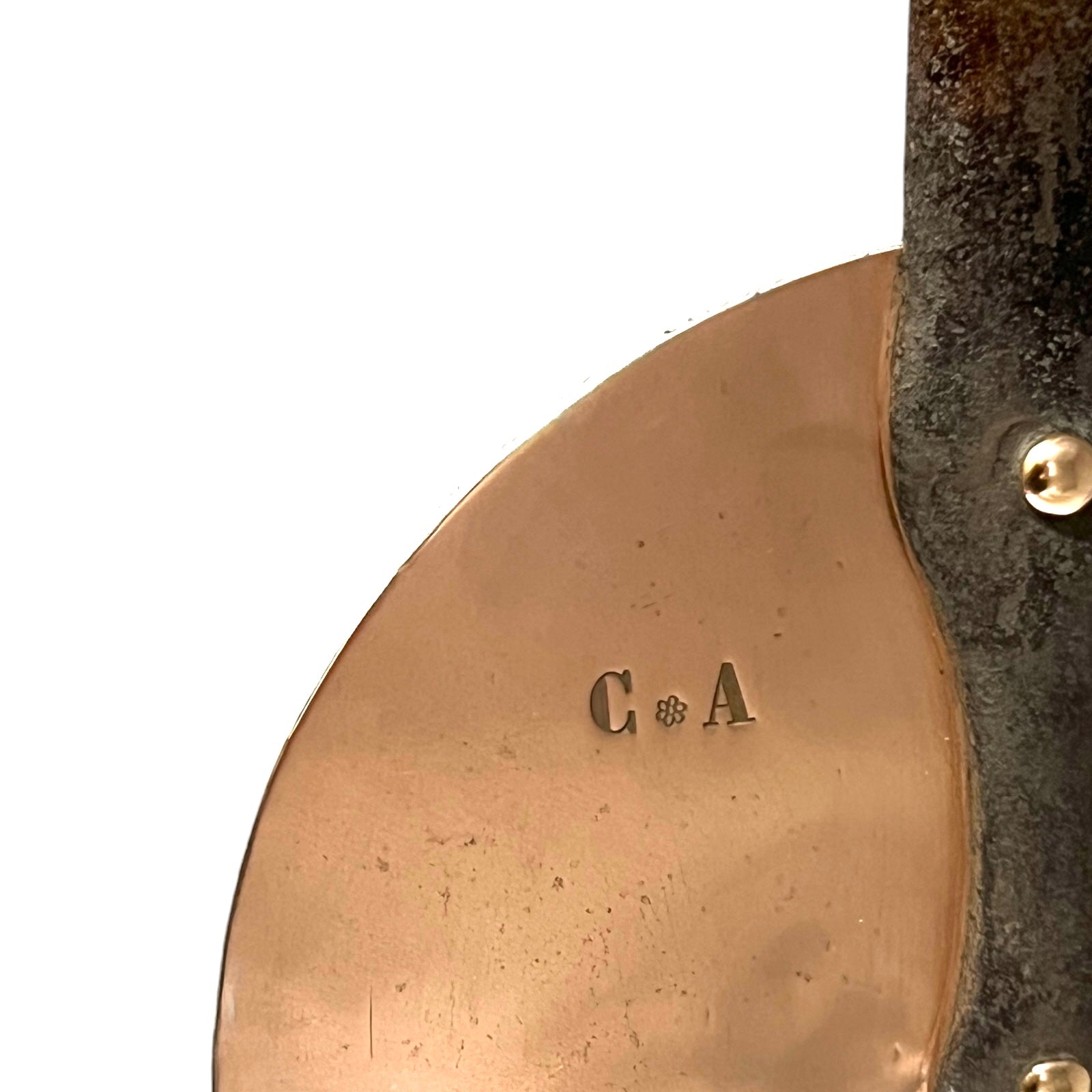 owners initials C and A on copper pan lid