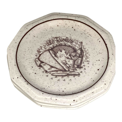  La Raclette plates with a decorative design on a white background