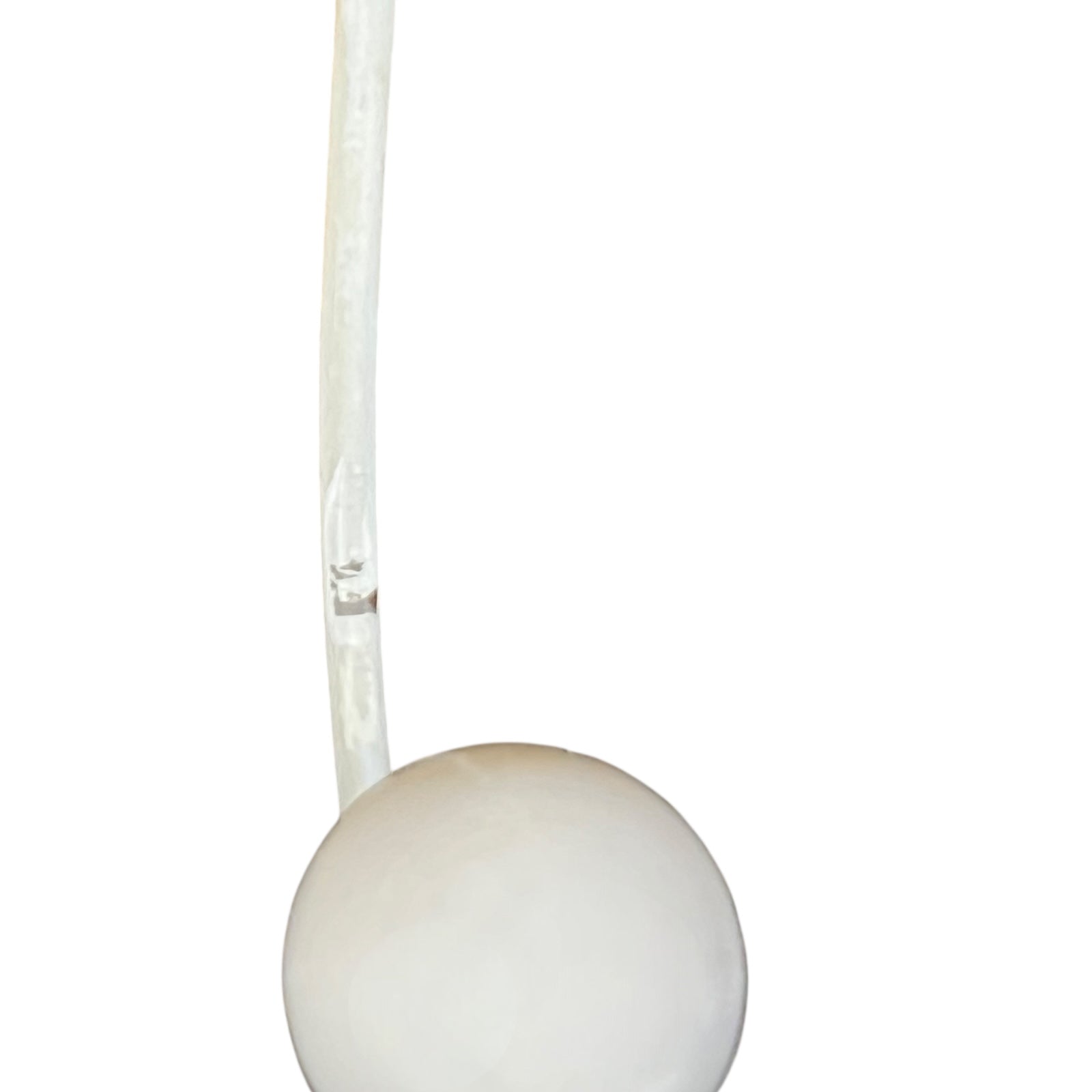 Close-up of a metal she with visible wear and tear on a white background