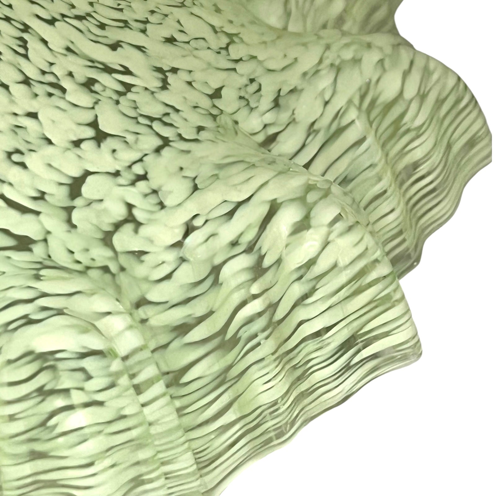 close up of light green milk glass pendant shade on a white background