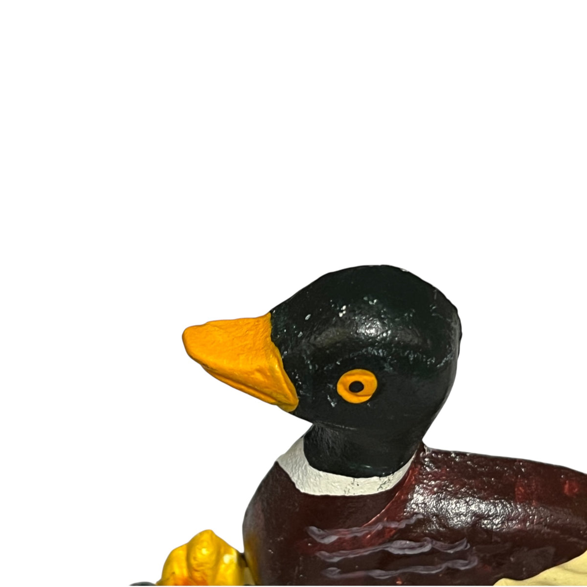 A close-up of a painted duck door stop on a plain white background. The duck has a glossy black head, yellow beak and eye, a white collar, and a dark reddish-brown body.