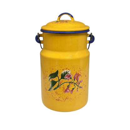 A vintage-style yellow enamel canister with a matching lid, featuring blue metal handles and a floral print on the front.