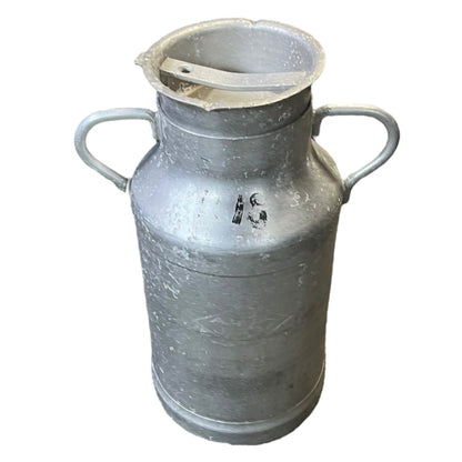 Metal milk churn on a white background