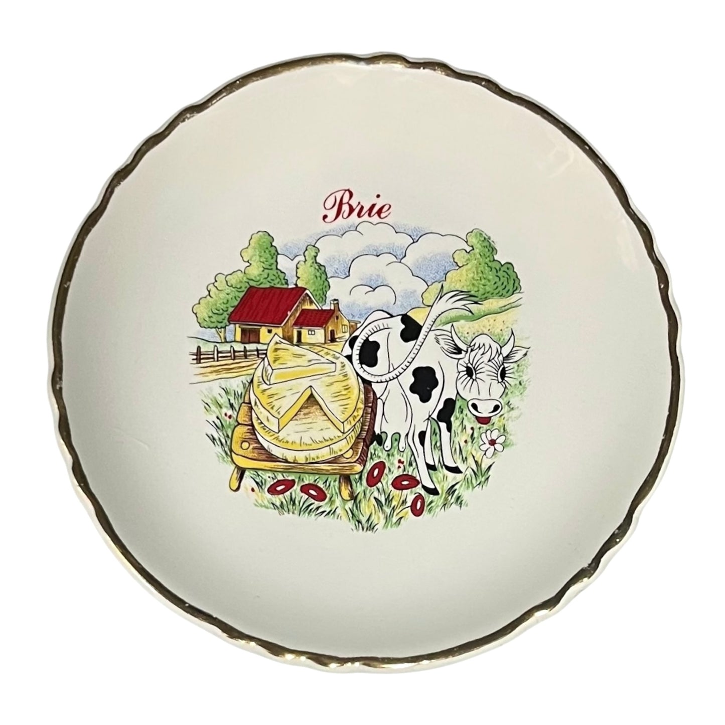 Decorative plate with a cow and Brie cheese illustration on a white background