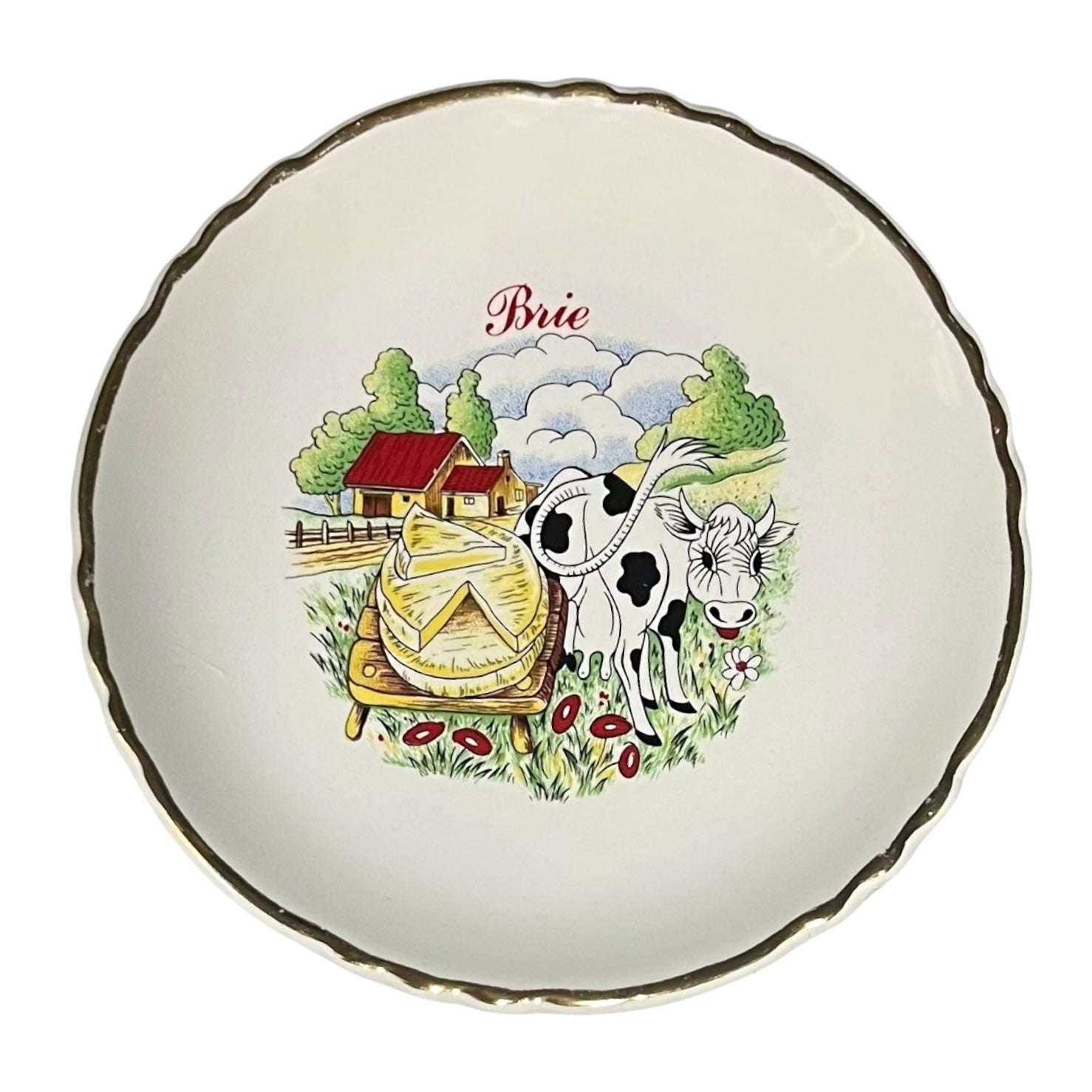 Decorative plate with a cow and Brie cheese illustration on a white background