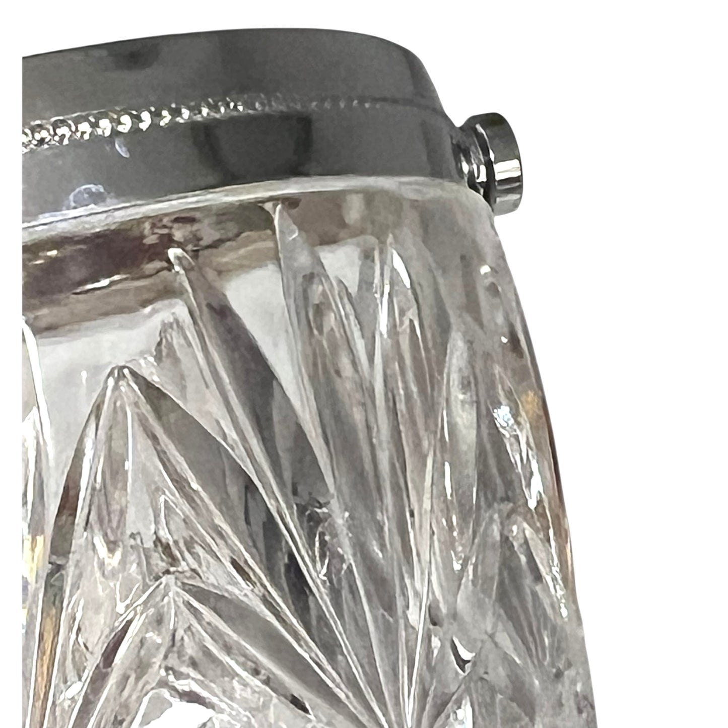 Close up of a French vintage glass ice bucket with silver rim on a white background