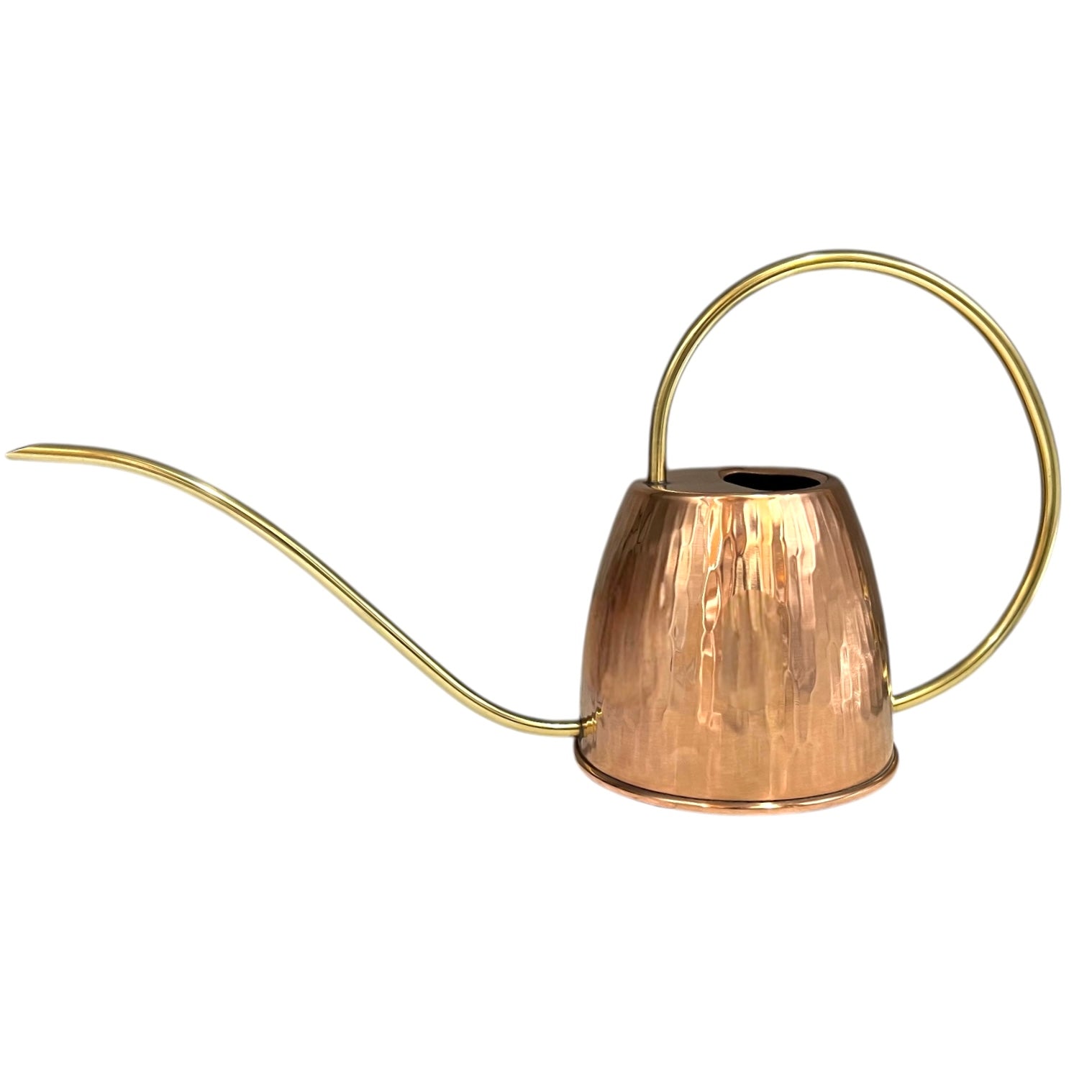 Copper watering can with a brass handle and spout on a white background