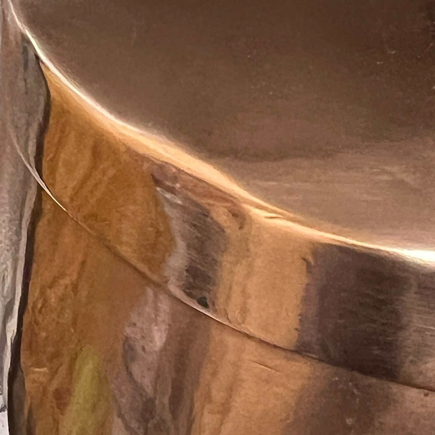Close up of a copper cooking pot stockpot with handles on a white background
