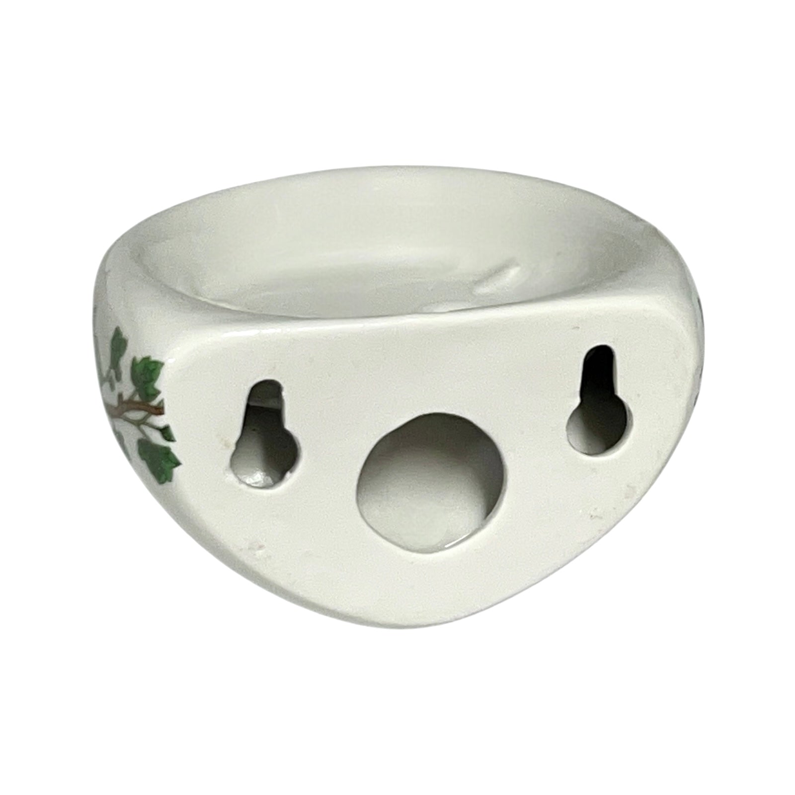Porcelain bathroom toothbrush holder  featuring green leaf patterns on a white background