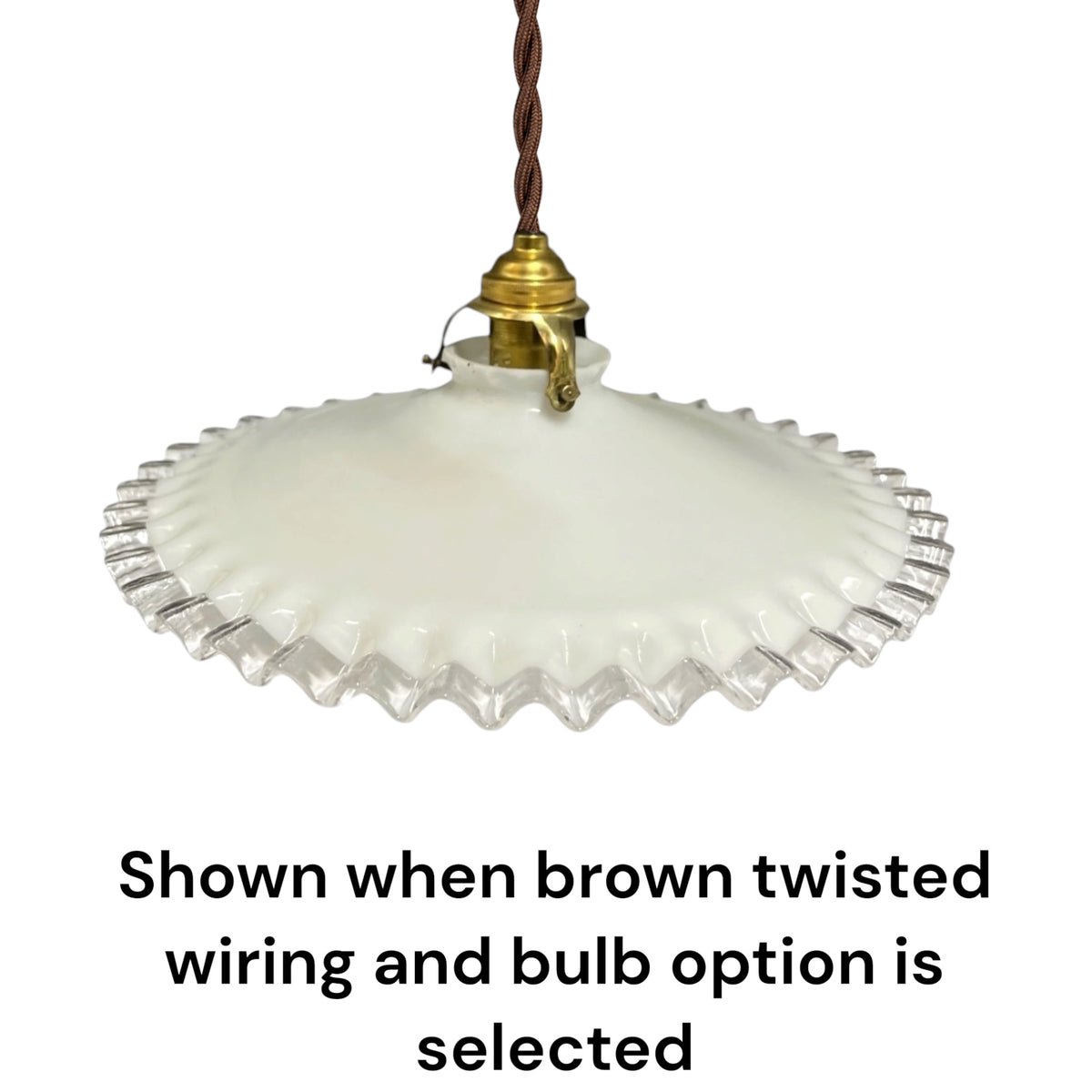 A vintage-style pendant light with a white ribbed glass shade and a brass-colored socket, suspended by a brown twisted wire. Text at the bottom reads, 'Shown when brown twisted wiring and bulb option is selected' on a plain white background.