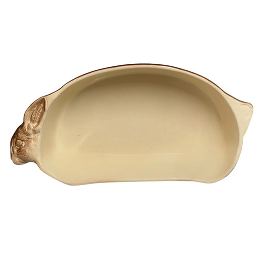 A beige ceramic 2-litre casserole dish shaped like a rabbit, featuring a brown exterior, perfect for serving game dishes or adding charm to a farmhouse-style country kitchen, set against a white background.