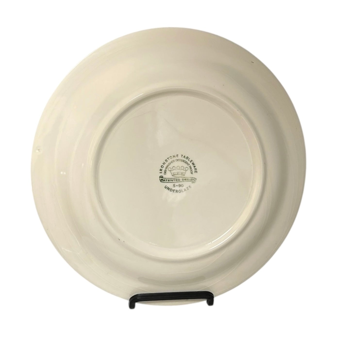 White ceramic plate with a visible brand logo on a white background