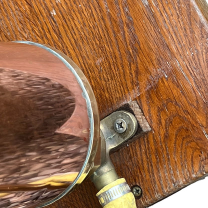 close up of a French copper garden sprayer on a white background 
