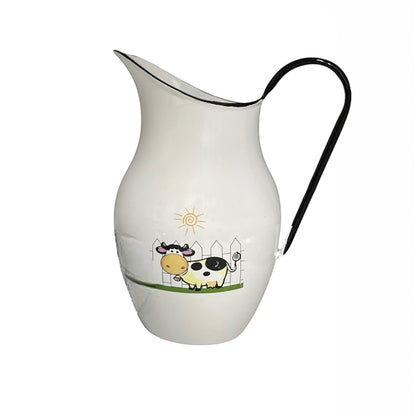 White ceramic pitcher with a cow design on a white background