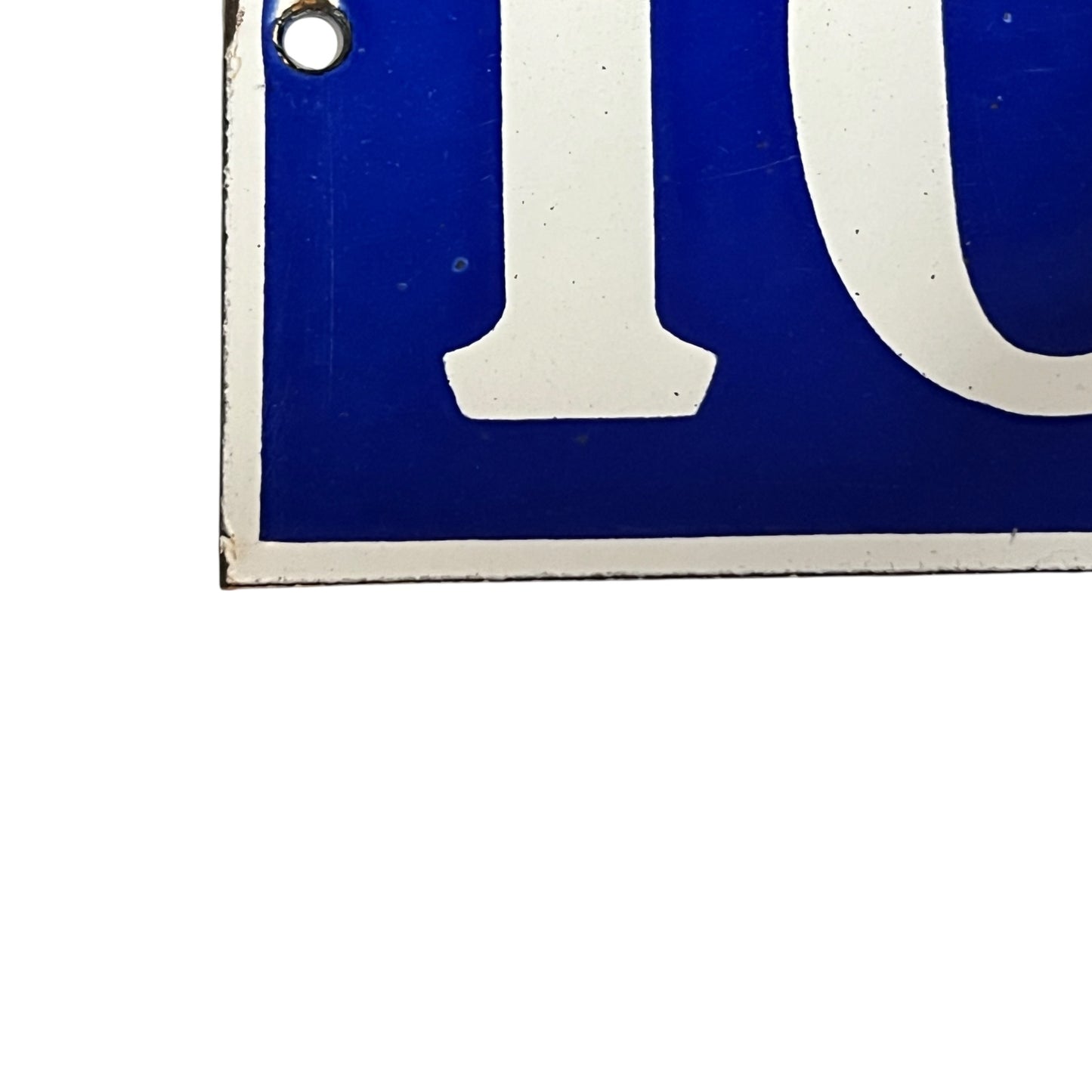 Close-up of a blue and white sign  on a white background