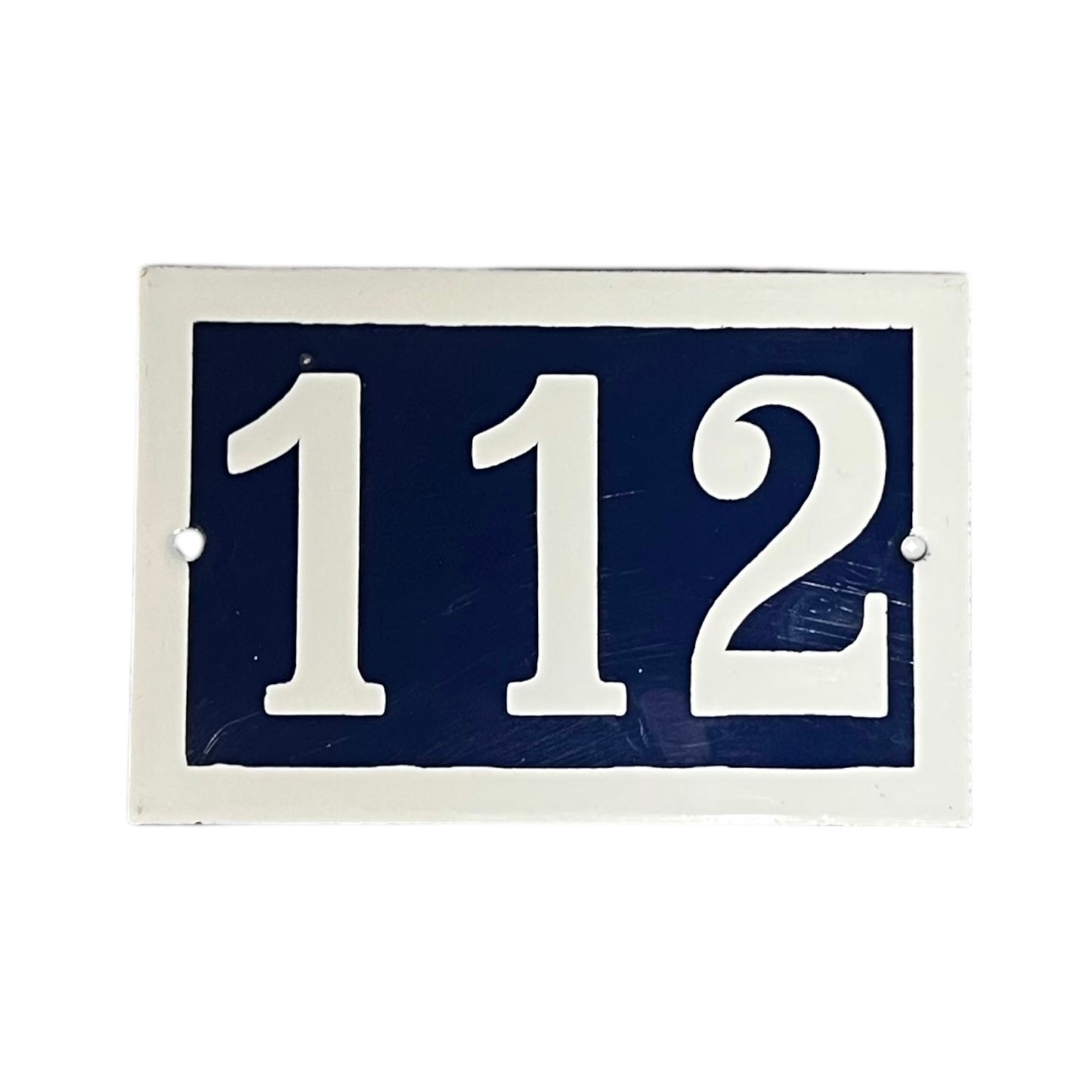 French enamel blue and white front door number 112 with a white border on a white background