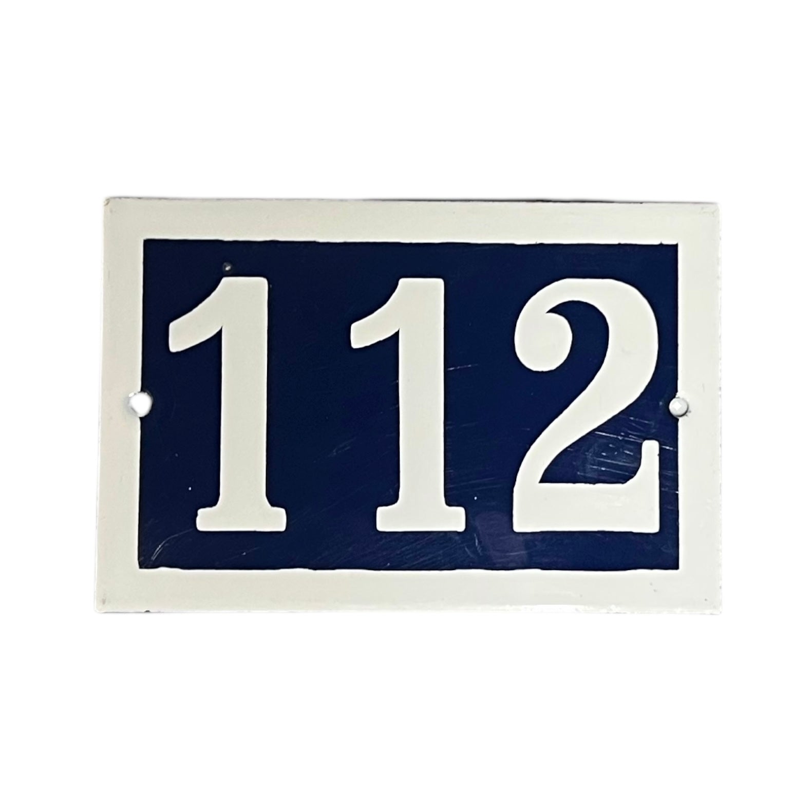French enamel blue and white front door number 112 with a white border on a white background