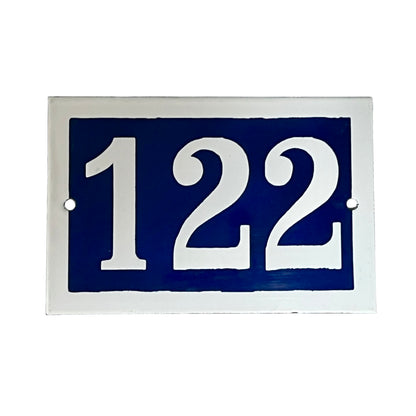 Blue rectangular sign with white numbers '122' on a white background