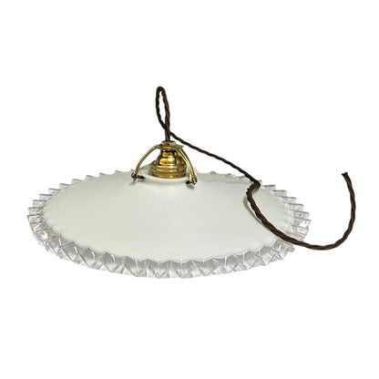 A vintage white glass pendant light shade with a scalloped, faceted edge, a gold metal top cap, and a dark brown hanging cord, shown against a plain white background.