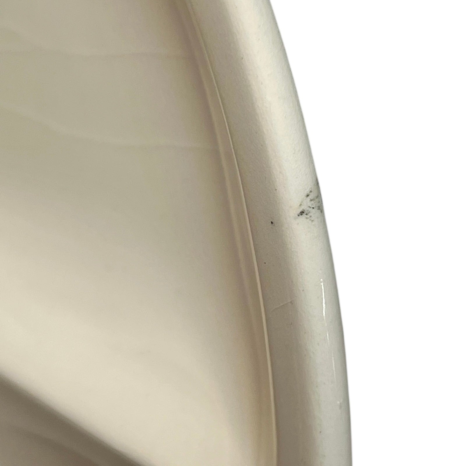 Close-up of the side of a plate on a white background