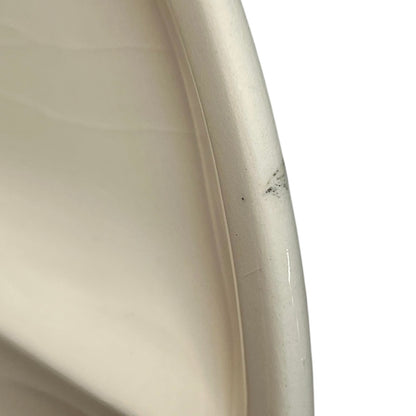 Close-up of the side of a plate on a white background