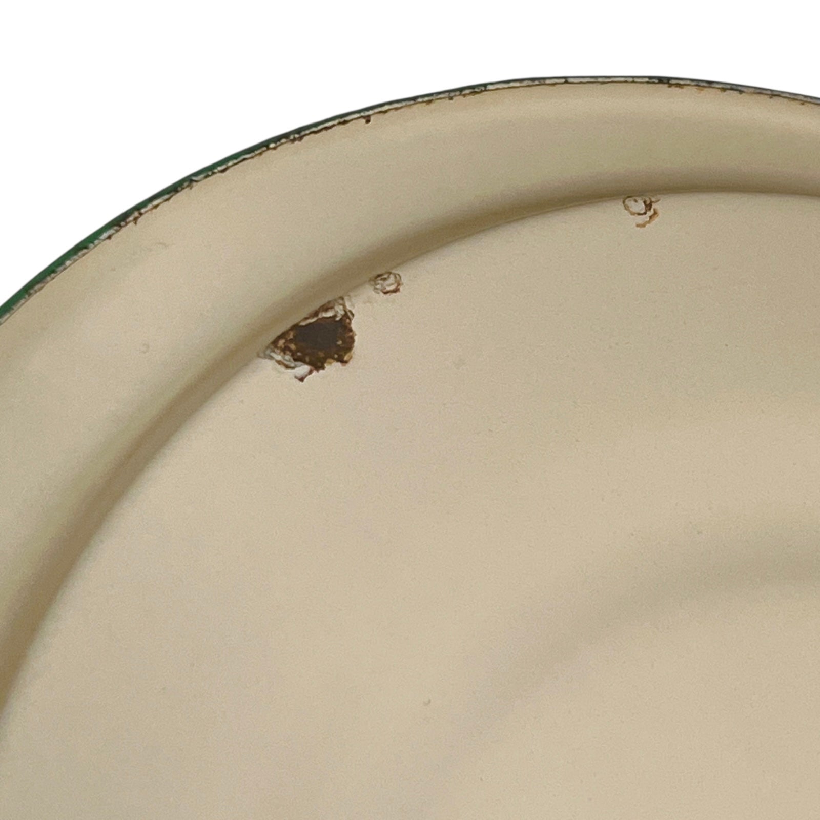 Close up of French vintage cream and green enamel bucket with a lid and handle on a white background