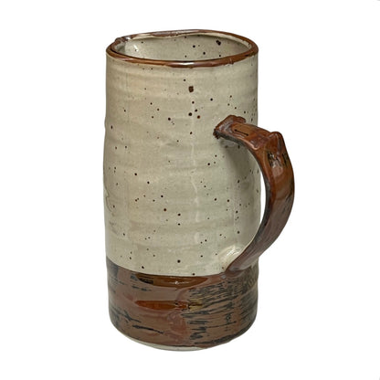 close up of ceramic glazed pitcher jug on a white background 