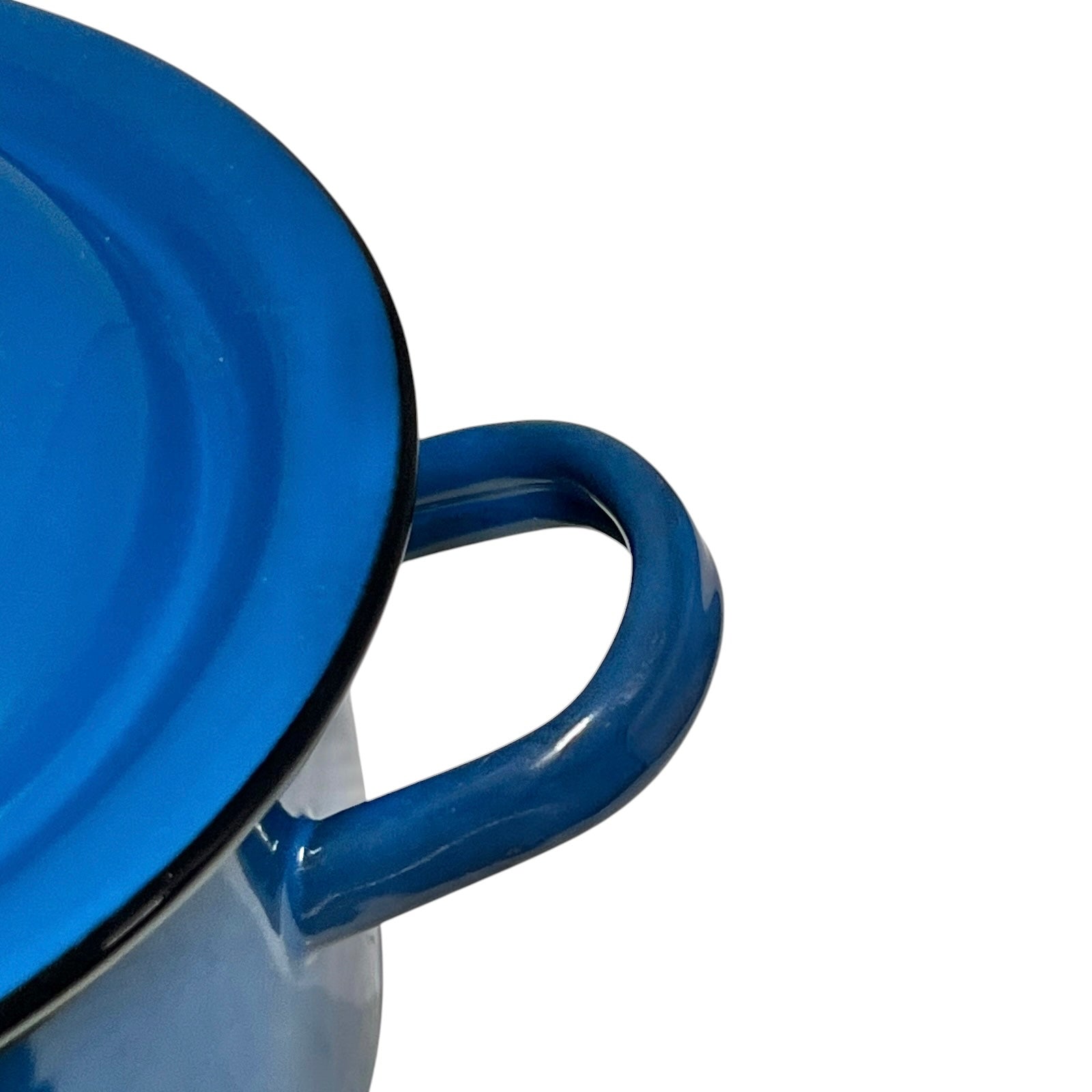 Close-up of a blue enamel pot handle and lid rim against a white background.