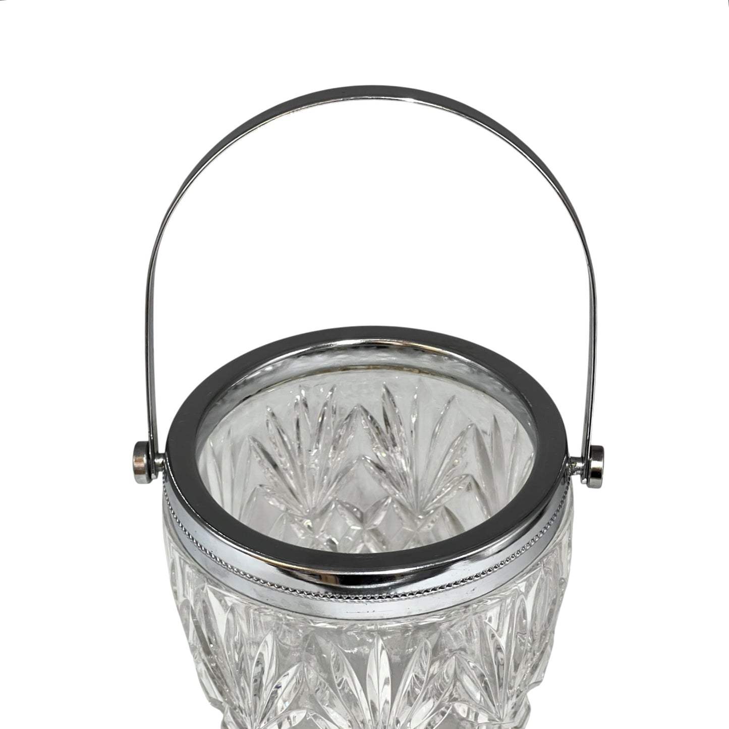 Crystal glass ice bucket with silver rim on a white background