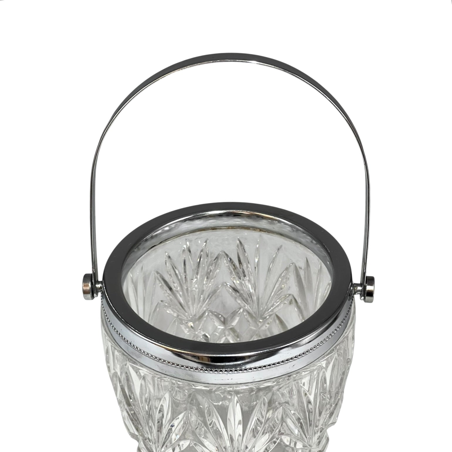 Crystal glass ice bucket with silver rim on a white background