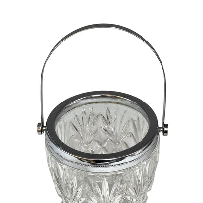 Crystal glass ice bucket with silver rim on a white background