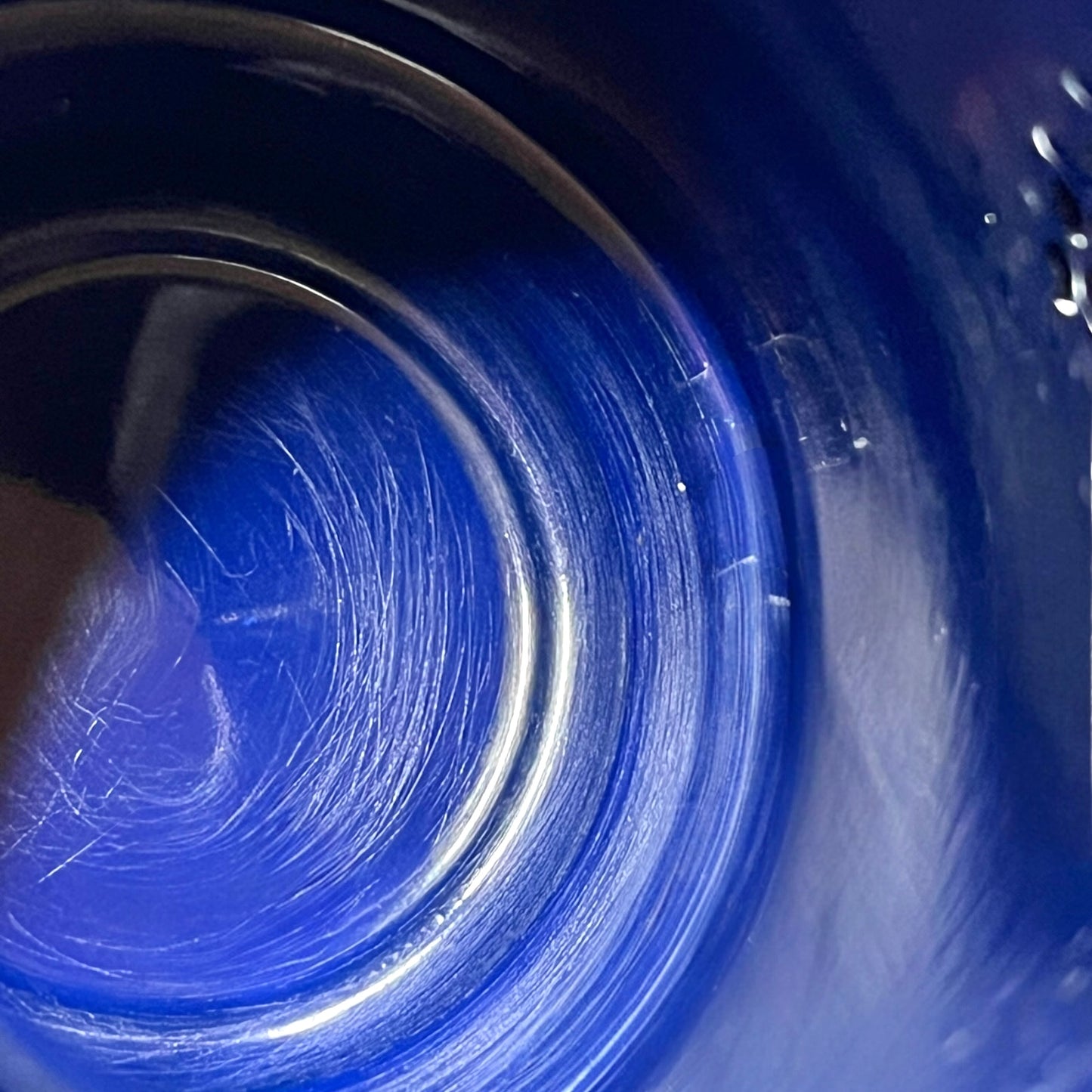 Close up of an enamel coffee pot on a white background
