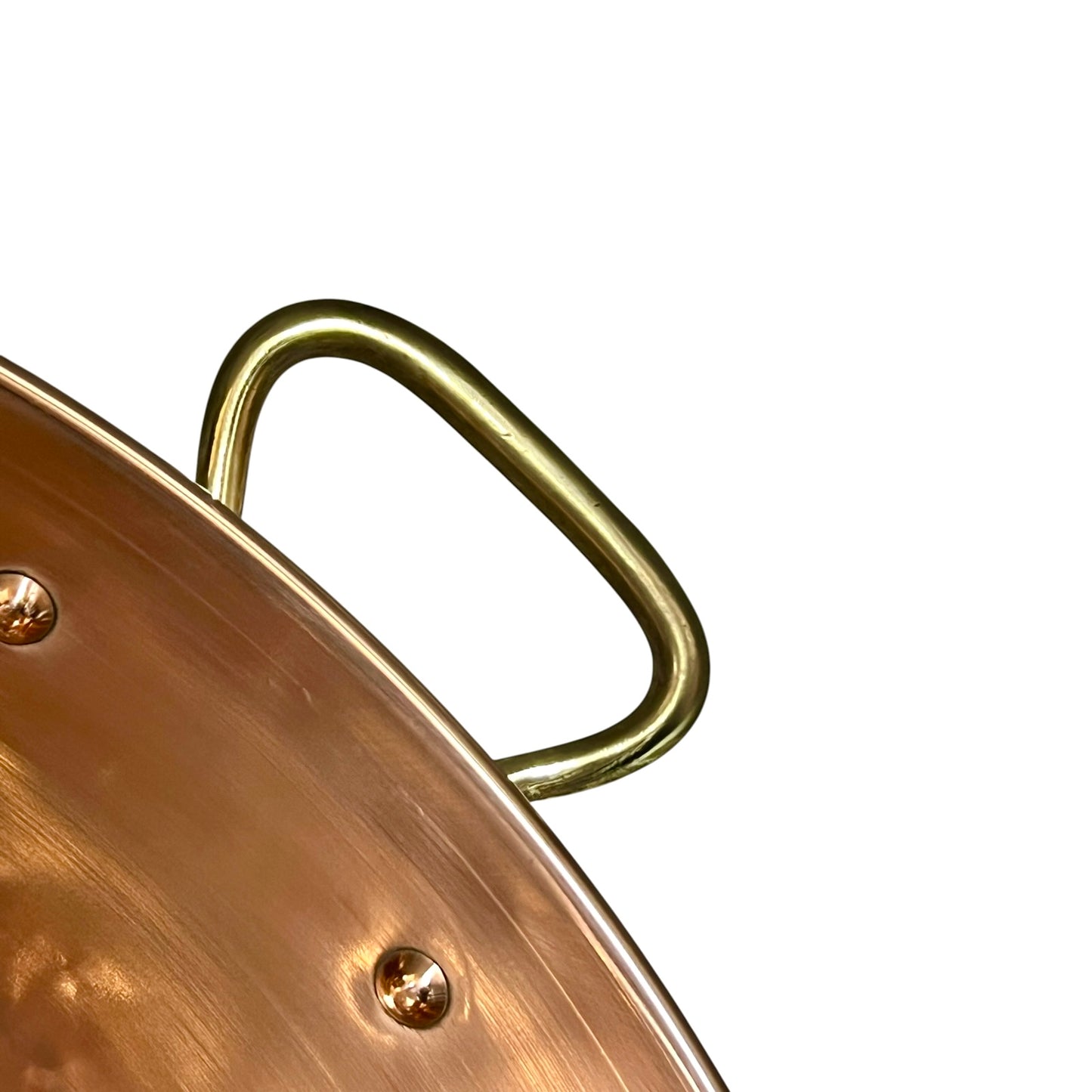 Close-up of a copper up cycled sink with brass handles on a white background.