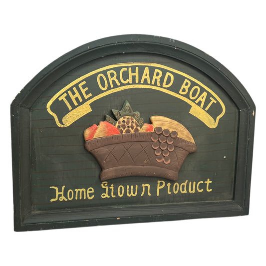Decorative sign with 'The Orchard Boat' and 'Home Grown Product' text on a white background