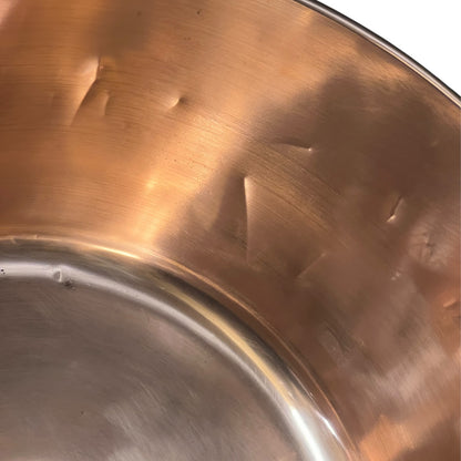 Close-up of a copper sink on a white background
