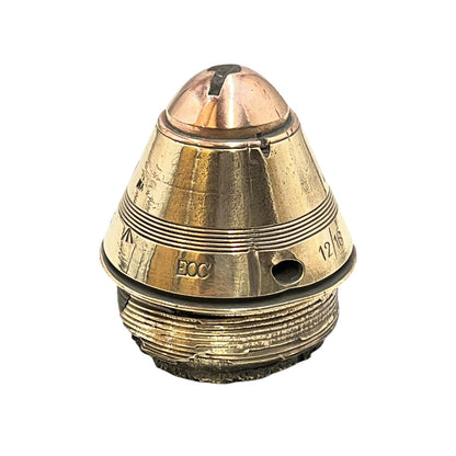 Polished British brass WW1 fuse or paperweight type 101 on a white background