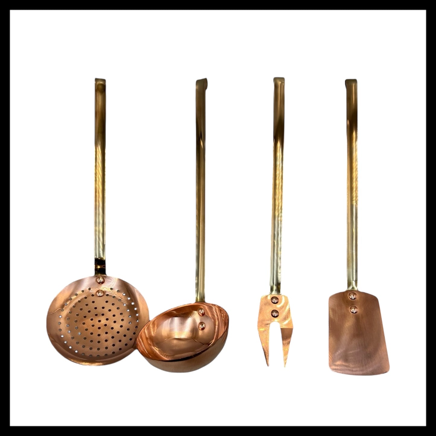 Set of 4 French copper and brass utensils including a slotted spoon, ladle, fork and spatula