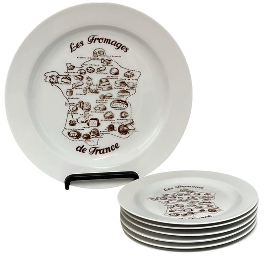 Set of white plates with French cheese map design on a white background