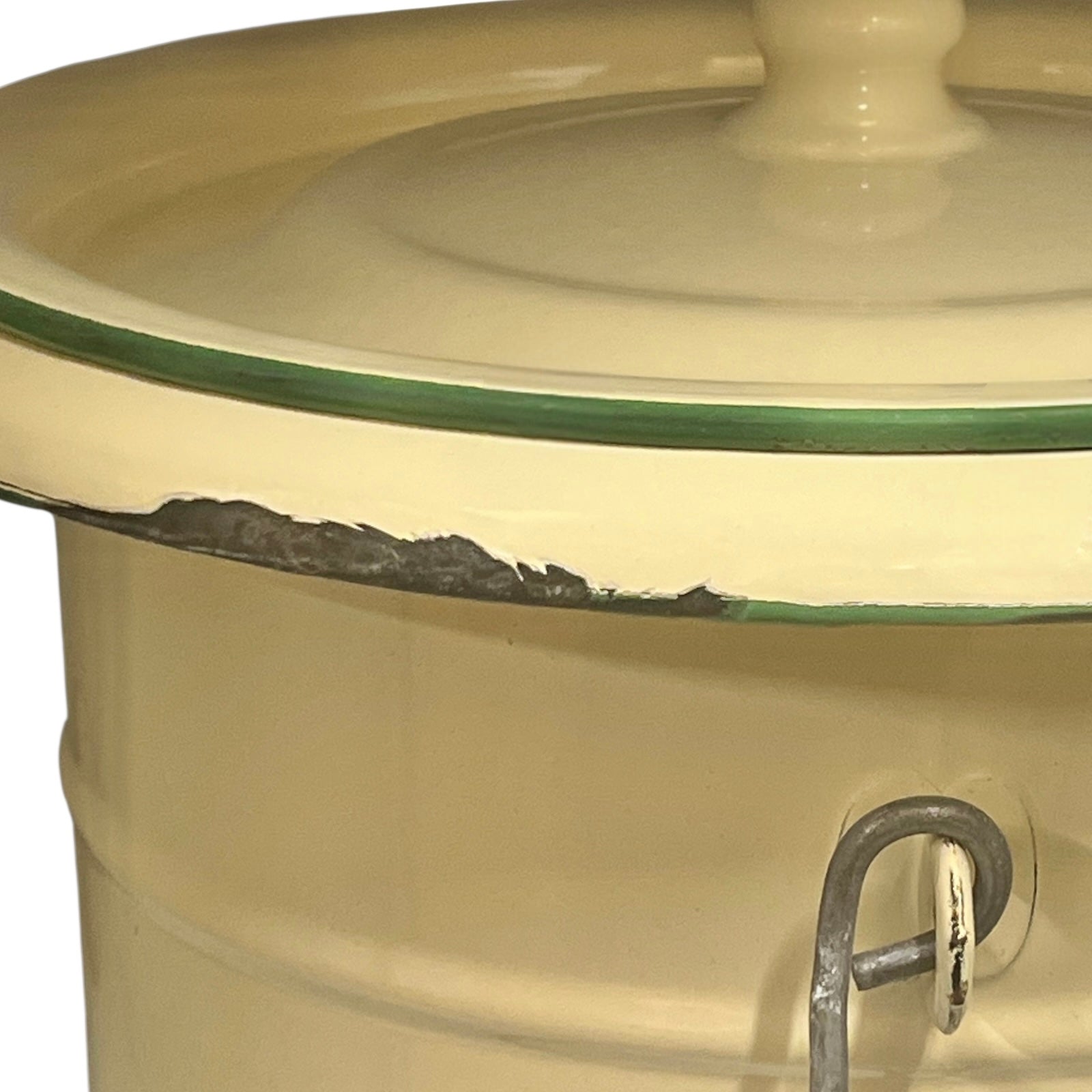 Close up of French vintage cream and green enamel bucket with a lid and handle on a white background