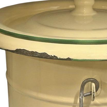 Close up of French vintage cream and green enamel bucket with a lid and handle on a white background