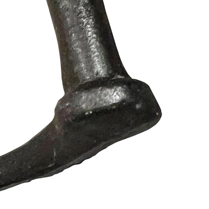 Close up of French farmhouse style goose cast iron toilet roll holder on a white background