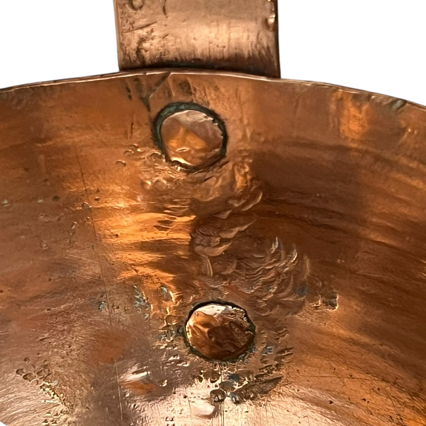 Close up of a French copper handmade ladle on a white background