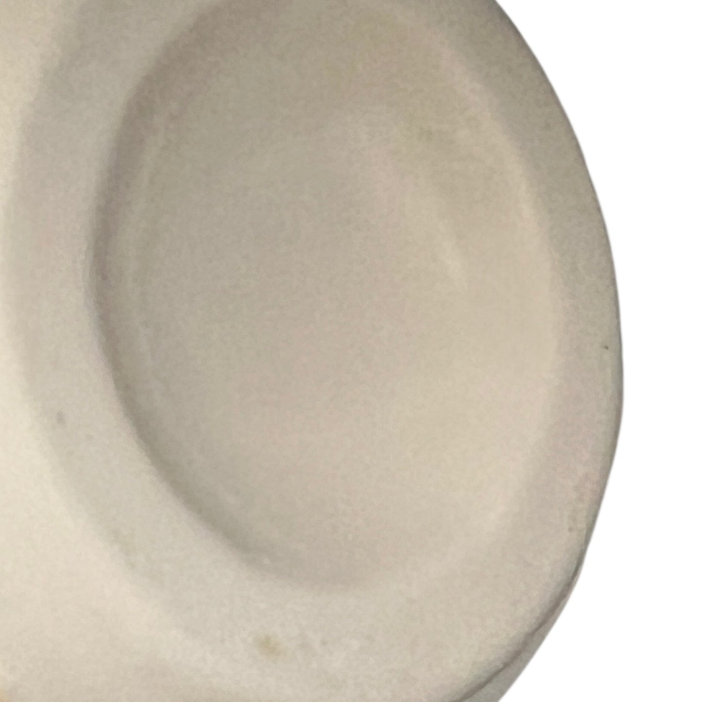 Close-up of a beige ceramic id on a white background