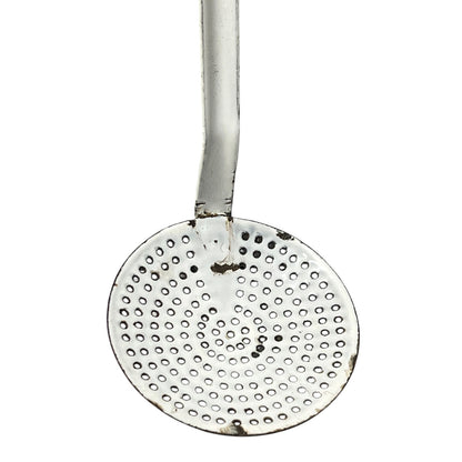 close up of a vintage kitchen utensil on a white background
